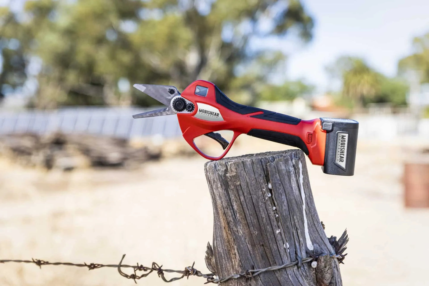 Mobishear 37mm hoof trimming secateur with Australian made foot paring blades attached on fence post with Australian farm background.